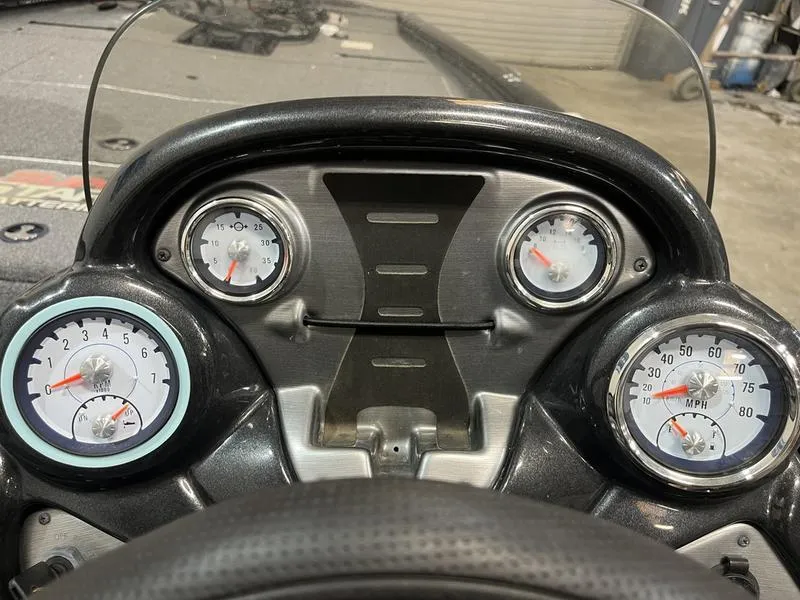Slide: The Image of Dashboard of a 2020 Tracker Pro Team 195 TXW boat with gauges. - 9