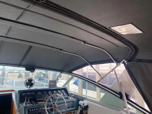 Slide: The Image of Interior view of 1987 Sea Ray 300 Weekender boat cockpit with steering wheel and dashboard. - 4