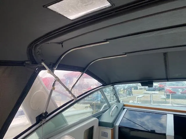 Slide: The Image of Interior view of a 1987 Sea Ray 300 Weekender boat with canopy and seating. - 5