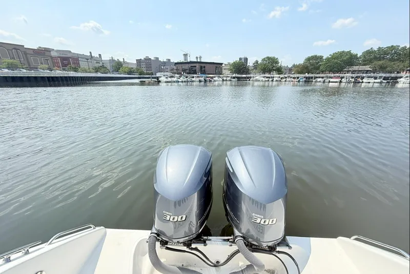 Slide: The Image of Twin Yamaha 300 engines on a 2015 Pursuit ST 310 Sport boat, dockside view. - 3