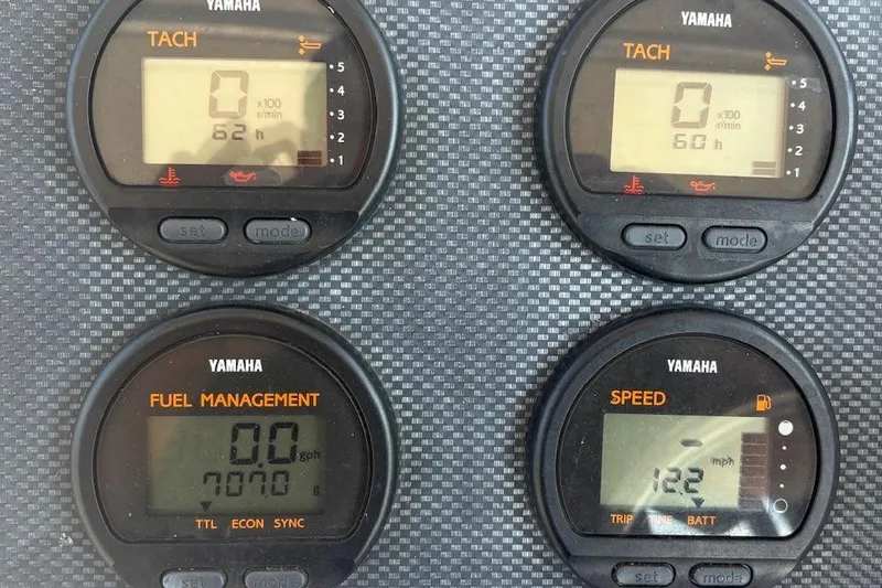 Slide: The Image of Yamaha gauges on 2003 Grady-White Sailfish 282, displaying tachometer, fuel management, and speed. - 17