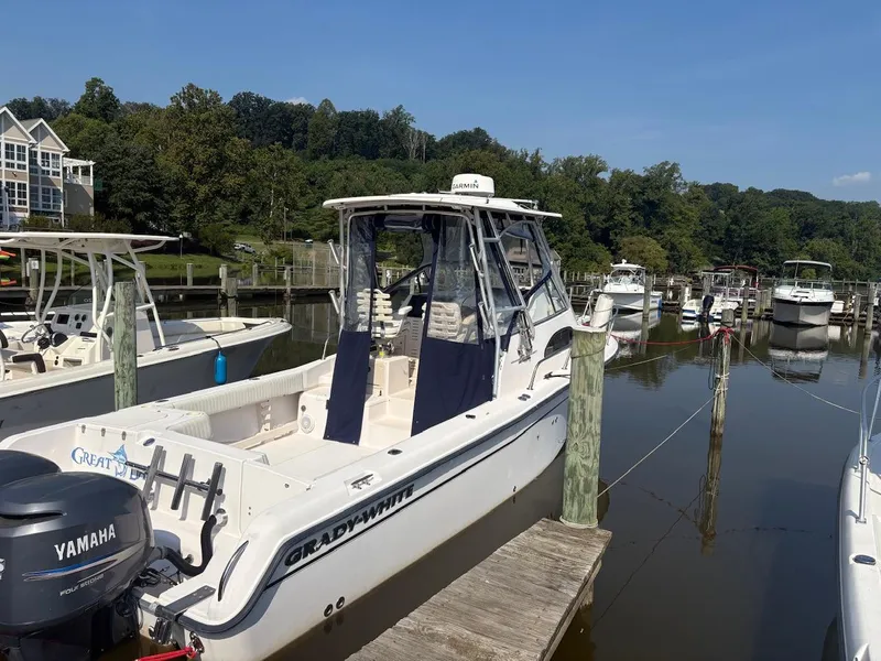 Slide: The Image of 2003 Grady-White Sailfish 282 boat docked in a marina with Yamaha outboard motor. - 4