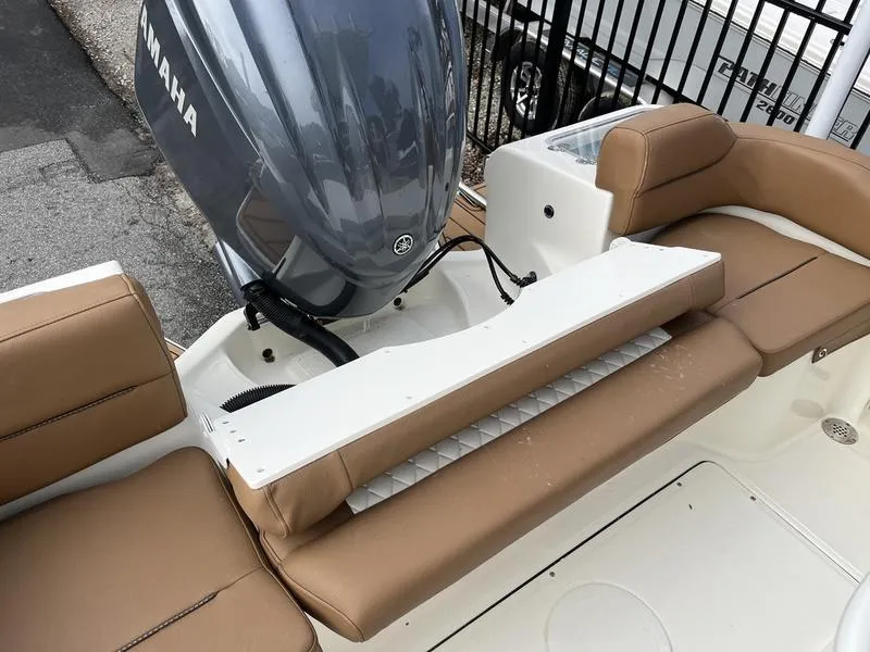 Slide: The Image of 2026 Pioneer 222 Islander boat with Yamaha engine, featuring tan seating and white deck. - 18