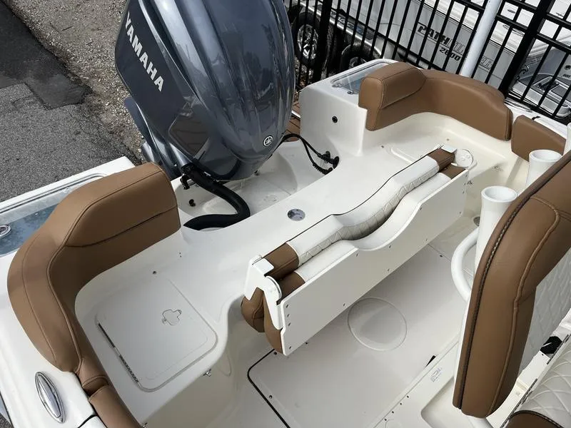 Slide: The Image of 2026 Pioneer 222 Islander boat with Yamaha engine, featuring brown seating and white deck. - 19