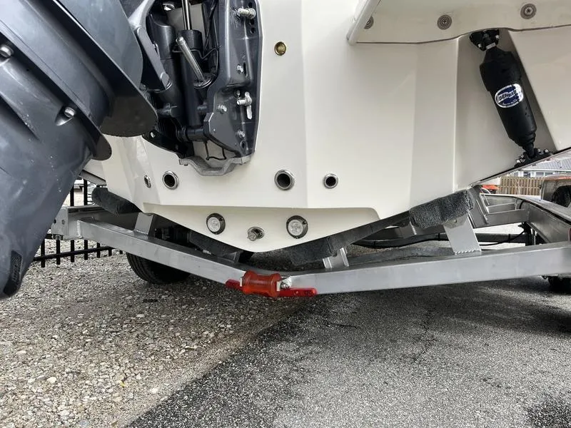 Slide: The Image of 2026 Pioneer 222 Islander boat on trailer, showing engine and hull details. - 22