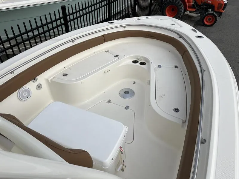 Slide: The Image of 2026 Pioneer 222 Islander boat interior with seating and storage compartments. - 6