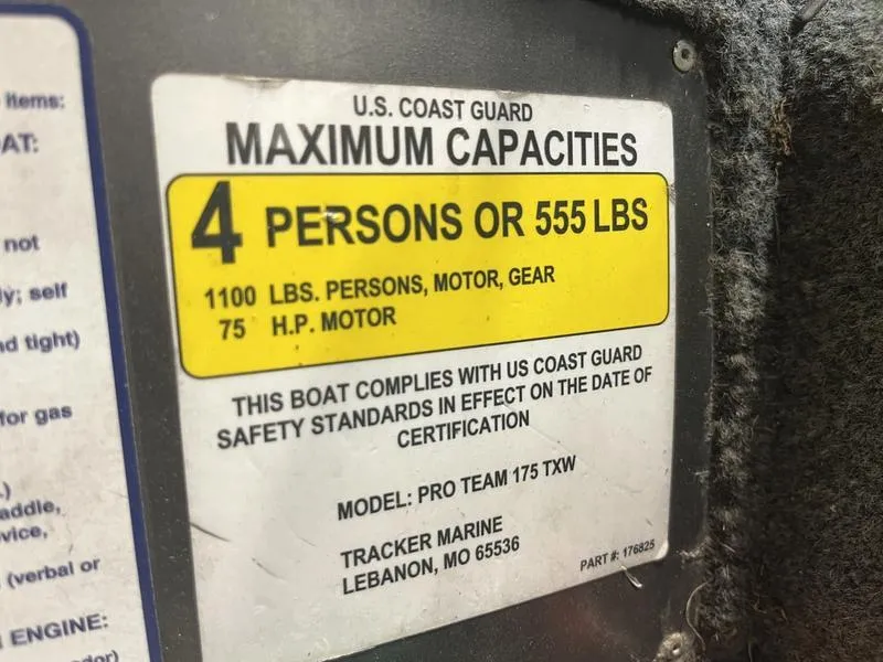 Slide: The Image of Label showing maximum capacity for 2019 Tracker Pro Team 175 TXW boat: 4 persons or 555 lbs. - 14