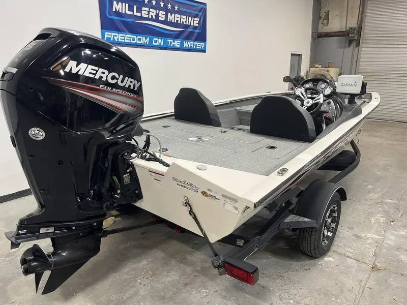 Slide: The Image of 2019 Tracker Pro Team 175 TXW boat with Mercury engine in a garage setting. - 3