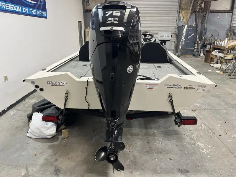 Slide: The Image of 2019 Tracker Pro Team 175 TXW boat with Mercury 75 engine in a garage. - 4