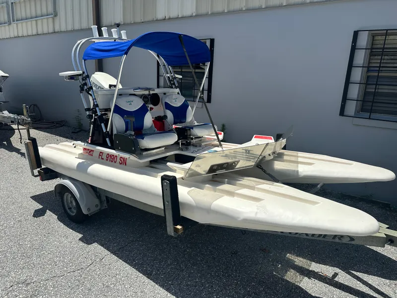 Slide: The Image of 2020 CraigCat E2 Elite on trailer, featuring blue canopy and dual seats. - 11