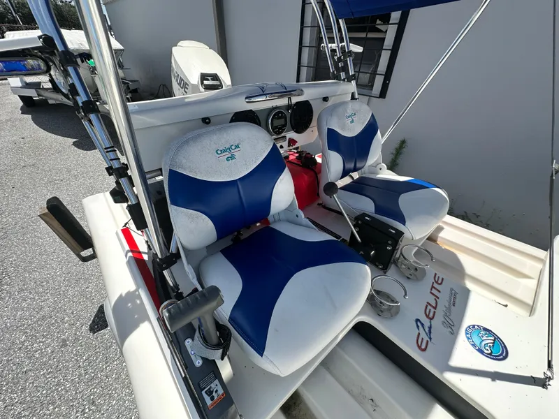 Slide: The Image of 2020 CraigCat E2 Elite with blue and white seats, featuring a compact design and steering controls. - 21