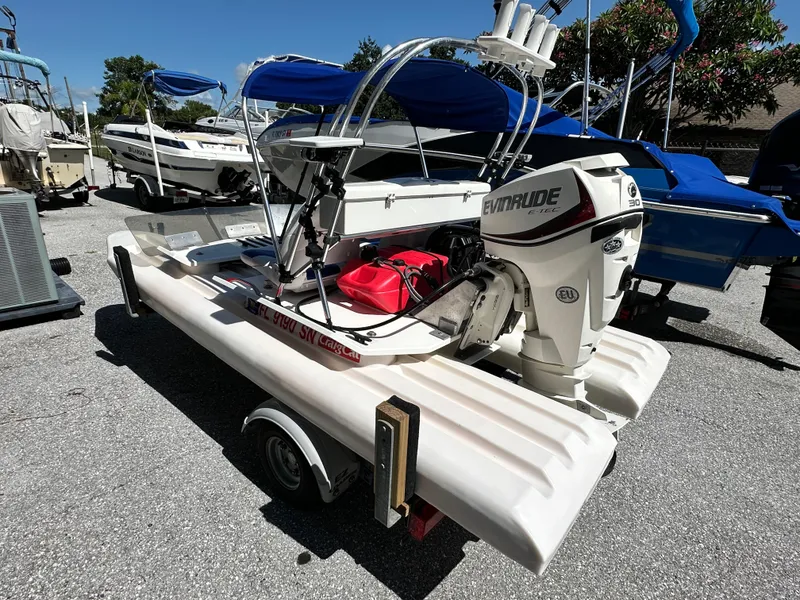 Slide: The Image of 2020 CraigCat E2 Elite with Evinrude motor on trailer, parked outdoors. - 5