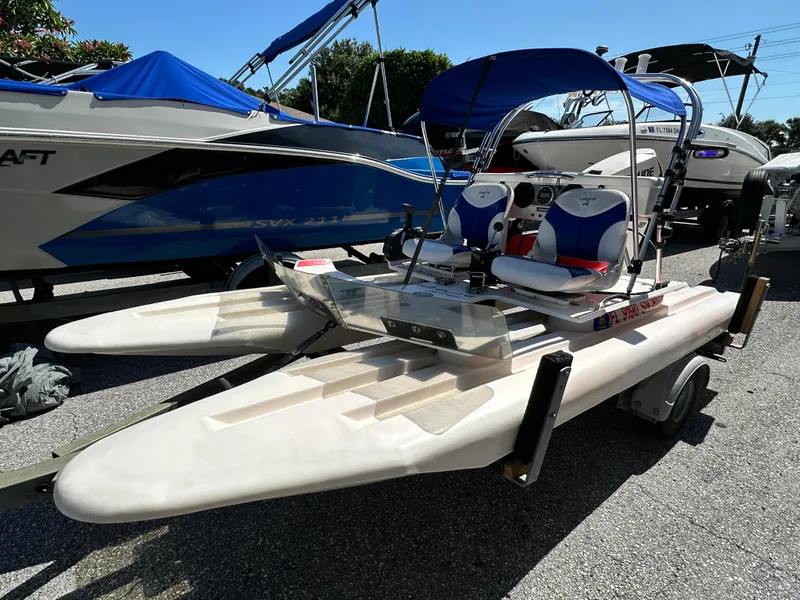 Slide: The Image of 2020 CraigCat E2 Elite catamaran on trailer, featuring dual seats and blue canopy. - 6