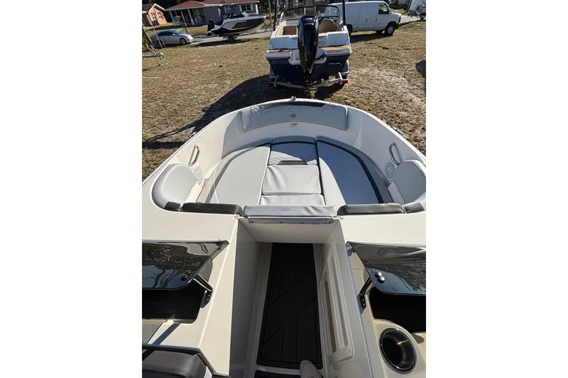 Slide: The Image of 2025 Bayliner Element M17 boat interior with seating and steering wheel. - 9