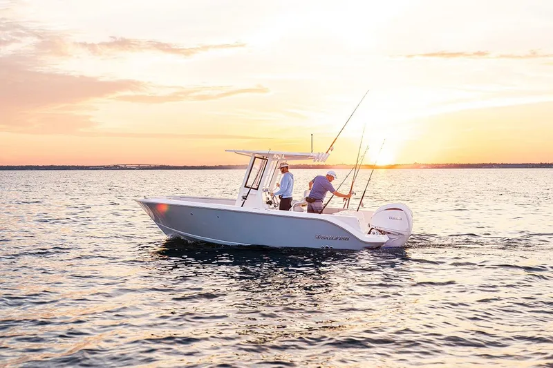 Slide: The Image of 2026 Sailfish 232 CC boat on water at sunset, two people fishing. - 21
