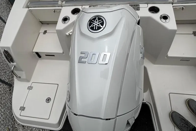 Slide: The Image of 2026 Sailfish 232 CC boat with Yamaha 200 outboard engine, rear deck view. - 22