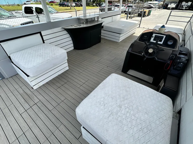 Slide: The Image of Modern Struktures AGF Cruise 2023 boat interior with white seating and steering console. - 10