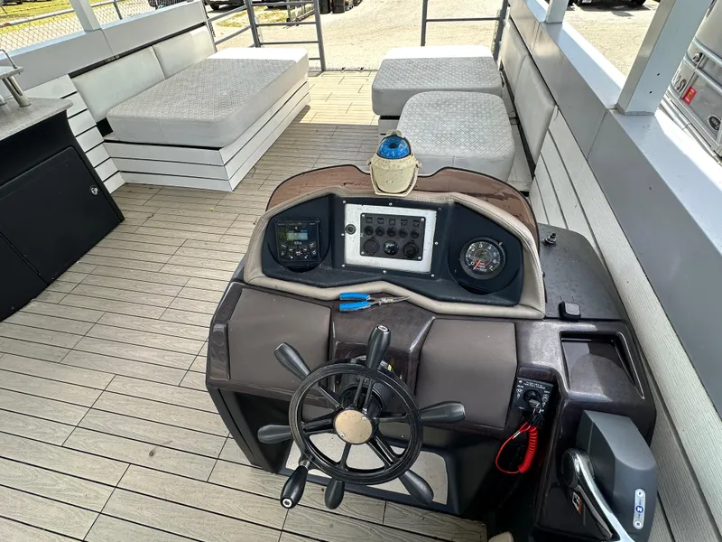 Slide: The Image of Modern Struktures AGF Cruise 2023 boat helm with steering wheel and control panel. - 11