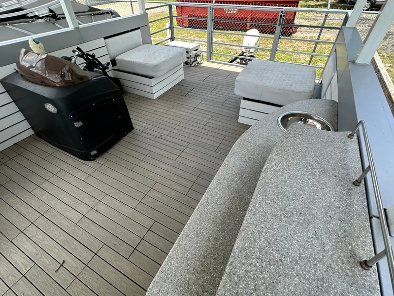 Slide: The Image of Modern Struktures AGF Cruise 2023 deck with seating, steering console, and outdoor flooring. - 12