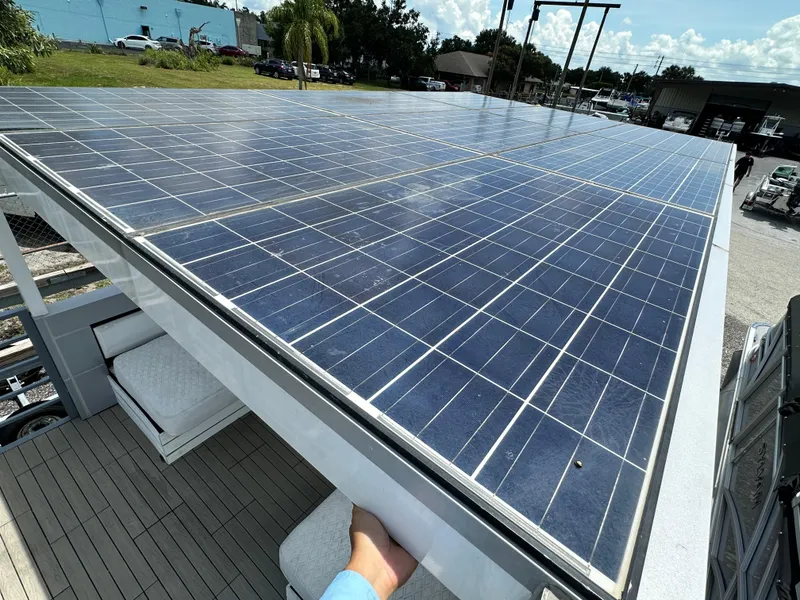 Slide: The Image of Solar panels on Modern Struktures AGF Cruise 2023, outdoor setting, sunny day. - 14