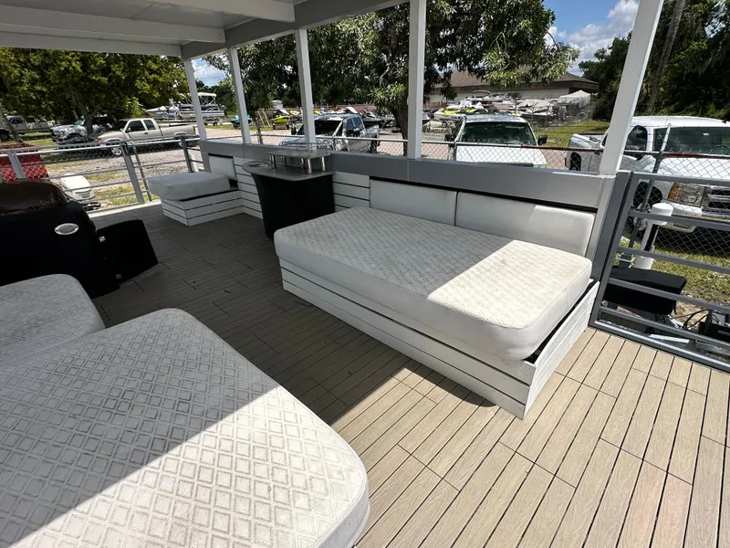 Slide: The Image of Modern Struktures AGF Cruise 2023 boat deck with cushioned seating and outdoor furniture. - 7