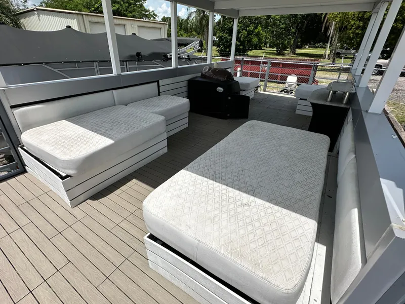 Slide: The Image of Spacious deck of 2023 Modern Struktures AGF Cruise with cushioned seating and wooden flooring. - 8