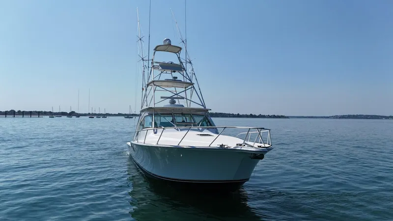 Slide: The Image of 2007 Albemarle 410 Express Fisherman boat on calm water, clear sky background. - 11