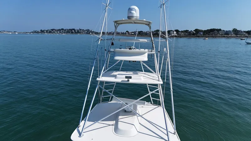 Slide: The Image of 2007 Albemarle 410 Express Fisherman boat on calm water with distant shoreline. - 13