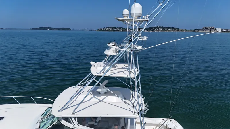 Slide: The Image of 2007 Albemarle 410 Express Fisherman yacht on calm blue waters, featuring a tall tower. - 14