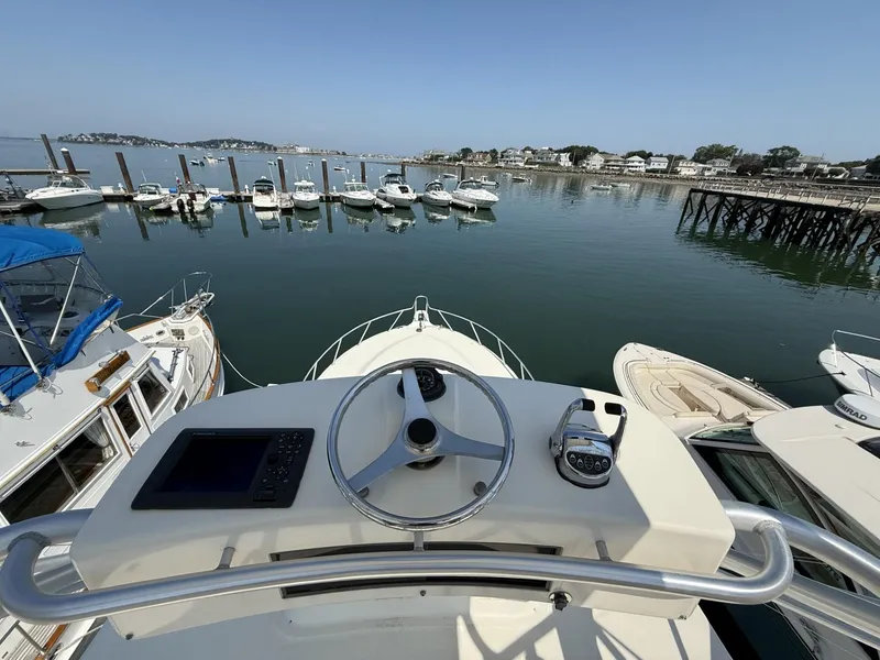 Slide: The Image of 2007 Albemarle 410 Express Fisherman at marina, view from helm, overlooking docked boats. - 15