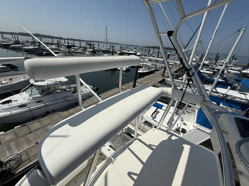 Slide: The Image of 2007 Albemarle 410 Express Fisherman at marina, showcasing upper deck and surrounding boats. - 17