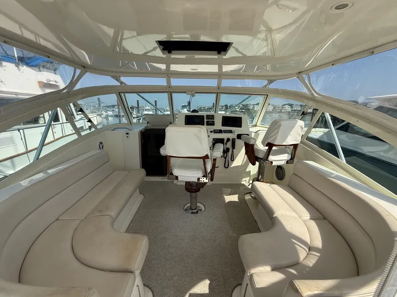 Slide: The Image of 2007 Albemarle 410 Express Fisherman interior with helm, seating, and panoramic windows. - 20