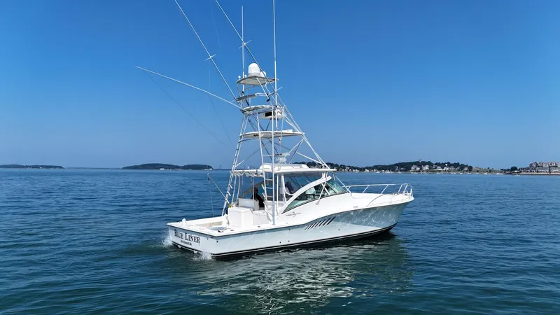 Slide: The Image of 2007 Albemarle 410 Express Fisherman boat on calm blue water, clear sky background. - 5