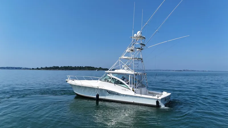 Slide: The Image of 2007 Albemarle 410 Express Fisherman boat on calm blue water under clear sky. - 9