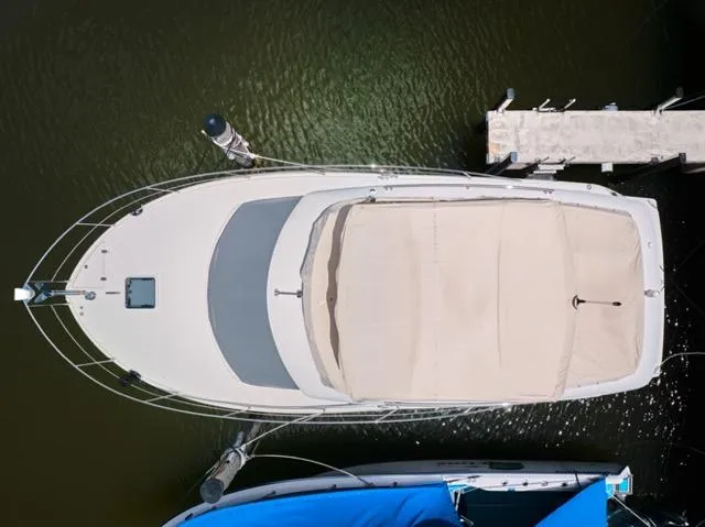 Slide: The Image of Overhead view of a 2015 Carver C34 Command Bridge docked at a marina. - 29