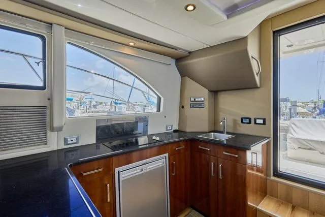 Slide: The Image of Luxurious kitchen interior of 2015 Carver C34 Command Bridge yacht with modern amenities. - 3