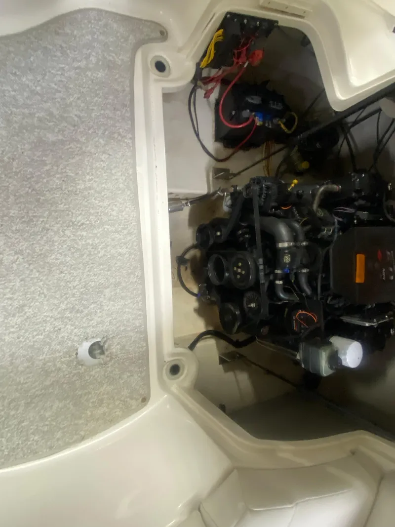 Slide: The Image of Engine compartment of a 2002 Chaparral Sunesta 243 boat, showing wiring and components. - 9
