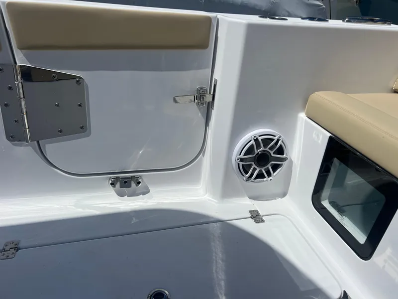 Slide: The Image of 2026 Sportsman 321 Heritage boat interior with speaker and seating. - 16