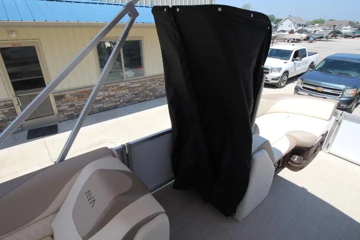 Slide: The Image of 2025 Avalon LSZ Versatile Rear Bench boat interior with seating and privacy curtain. - 10