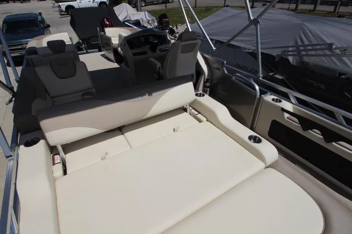 Slide: The Image of 2025 Avalon LSZ Versatile Rear Bench boat with luxurious seating and modern design. - 7