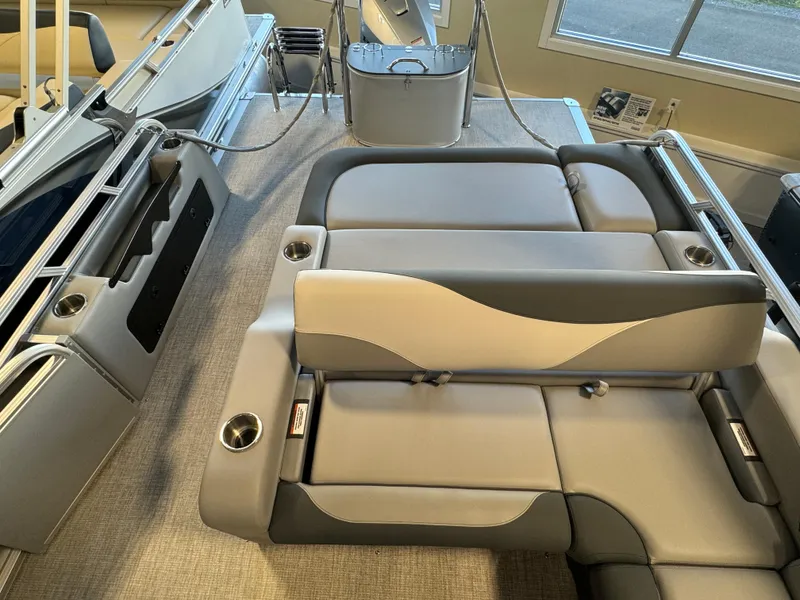 Slide: The Image of 2025 Avalon LSZ VRB pontoon boat interior with plush seating and cup holders. - 10