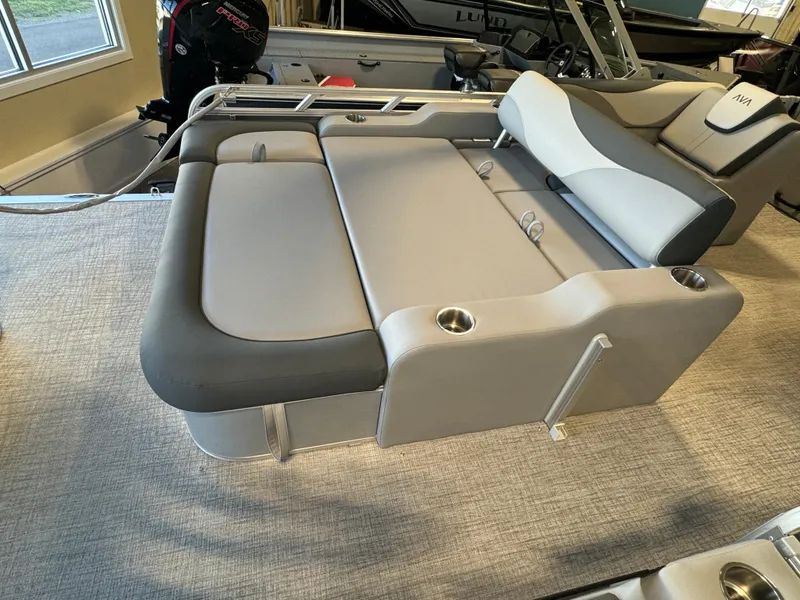 Slide: The Image of 2025 Avalon LSZ VRB boat interior with gray seating and cup holders. - 11