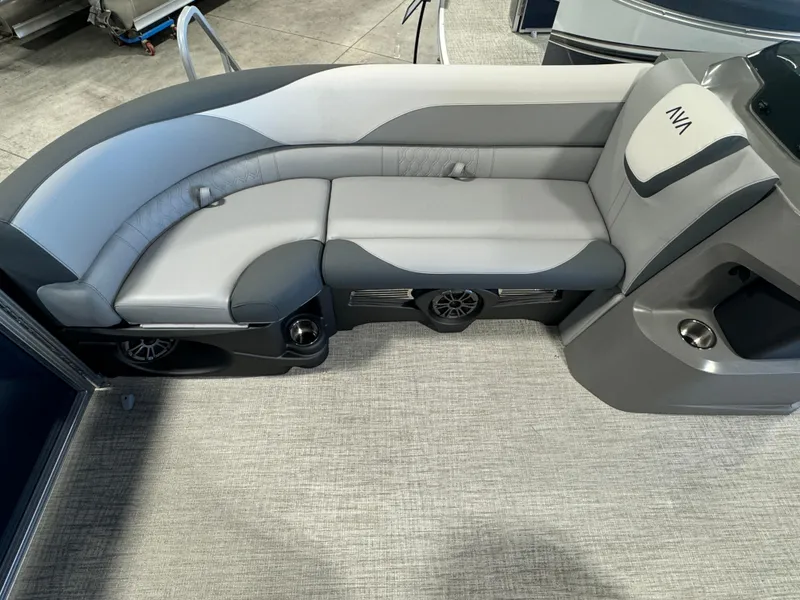 Slide: The Image of Luxurious seating in 2025 Avalon LSZ VRB boat, featuring sleek gray upholstery and integrated speakers. - 7