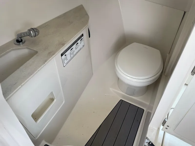 Slide: The Image of Interior of 2023 Sailfish 276 DC with toilet and sink. - 12