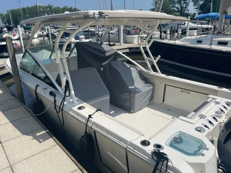 Slide: The Image of 2023 Sailfish 276 DC boat docked at marina. - 3