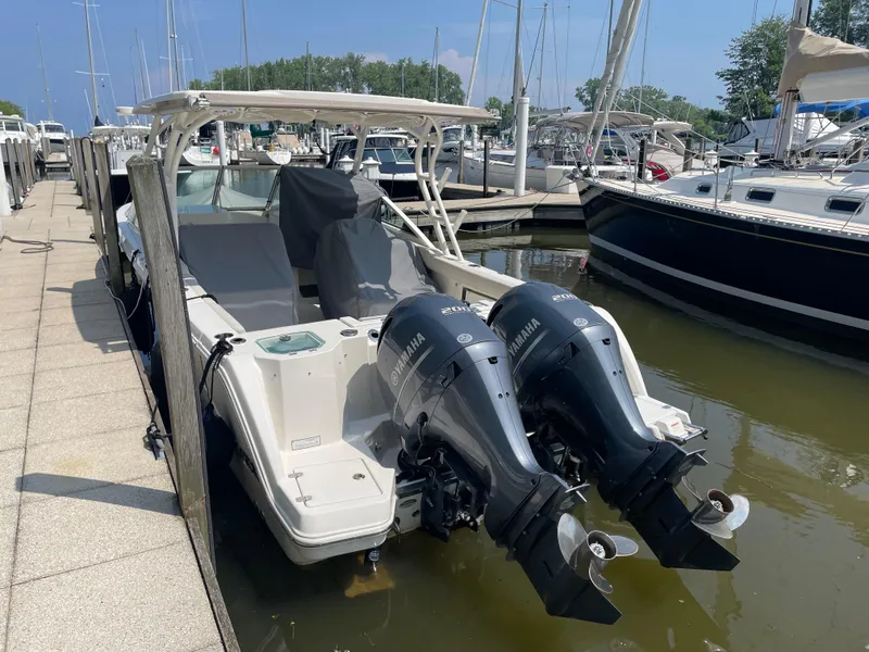 Slide: The Image of Sailfish 276 DC 2023 boat with Yamaha engines in harbor. - 4