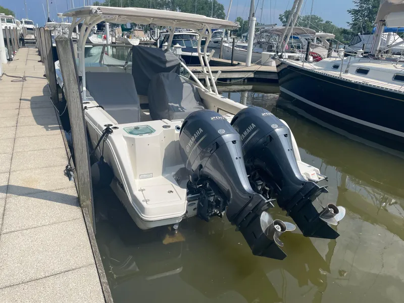 Slide: The Image of Sailfish 276 DC 2023 boat with Yamaha engines docked. - 7