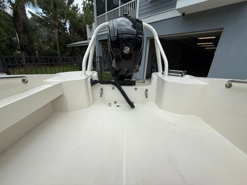 Slide: The Image of 2022 Boston Whaler 160 Super Sport boat interior with outboard motor. - 14