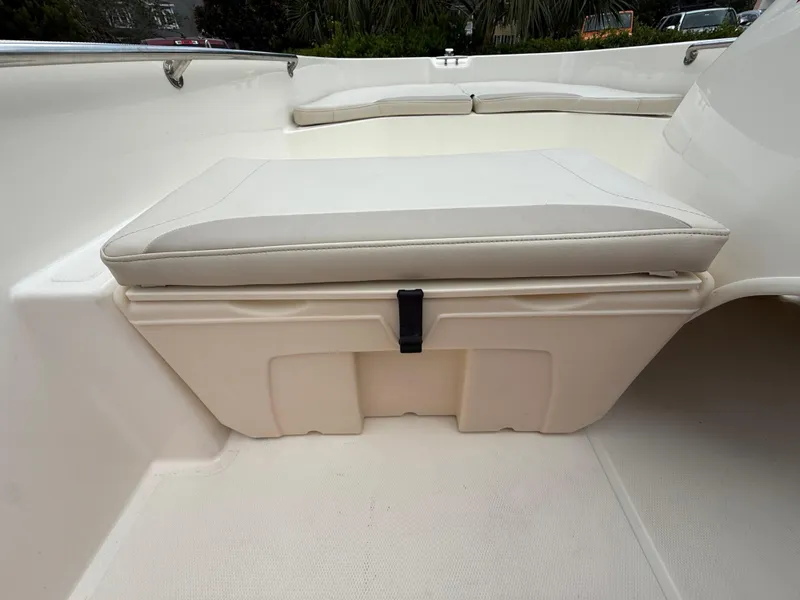 Slide: The Image of 2022 Boston Whaler 160 Super Sport interior seating with storage compartment. - 15