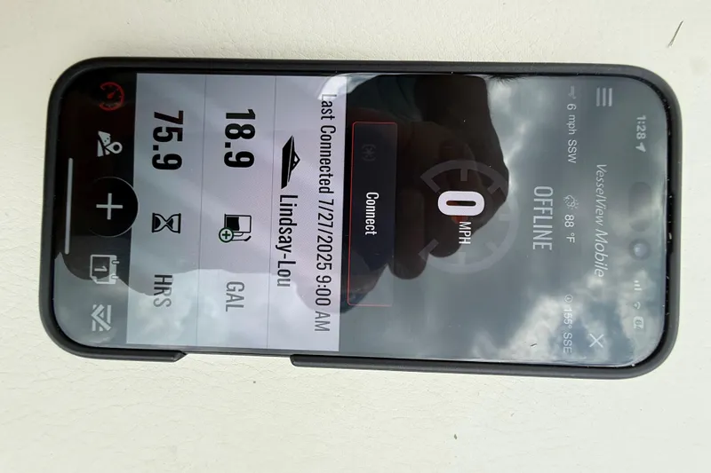 Slide: The Image of Smartphone displaying VesselView Mobile app for Boston Whaler 160 Super Sport, showing offline status and fuel data. - 20